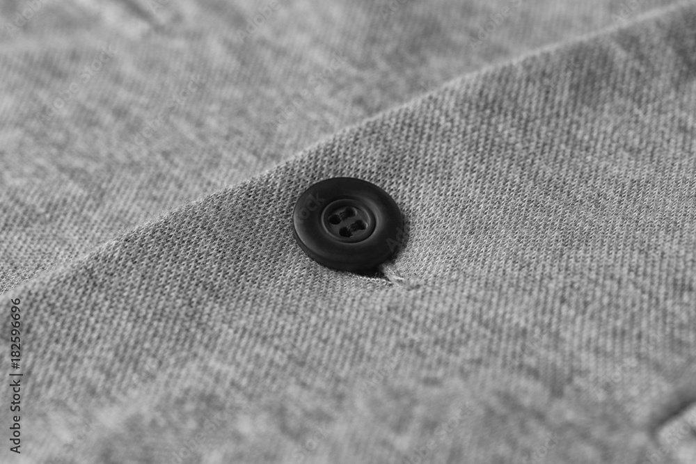 Button on elegant male suit, closeup Button on elegant male suit, closeup