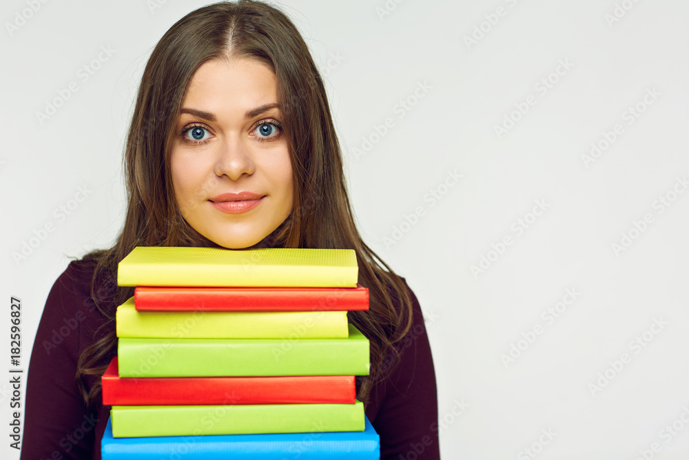 Close up portrait of student girl with books pile. Close up portrait of student girl with books pile.