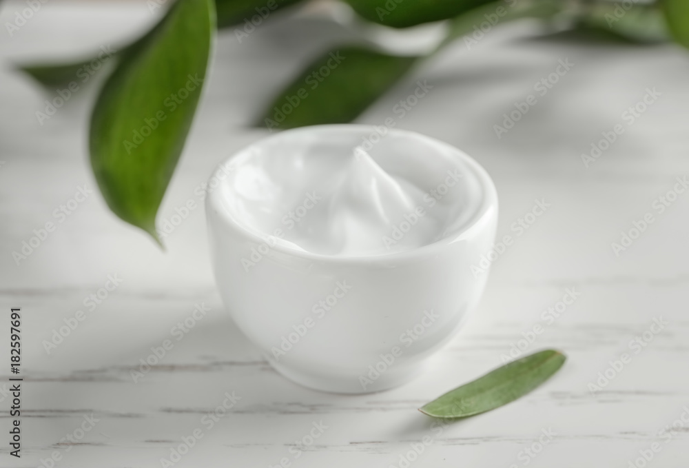 Bowl of body cream on table Bowl of body cream on table