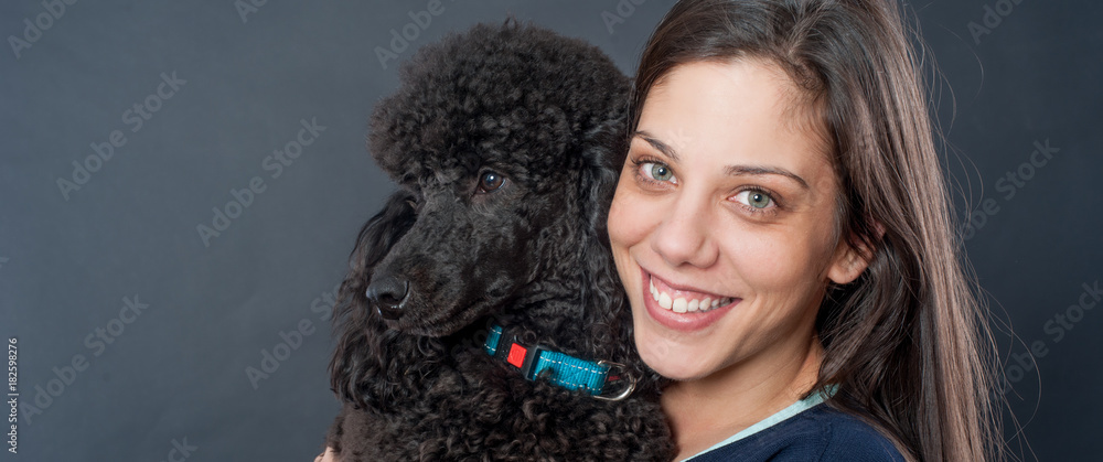 Portrait of a beautiful young woman hugging her beautiful dog Portrait of a beautiful young woman hugging her beautiful dog