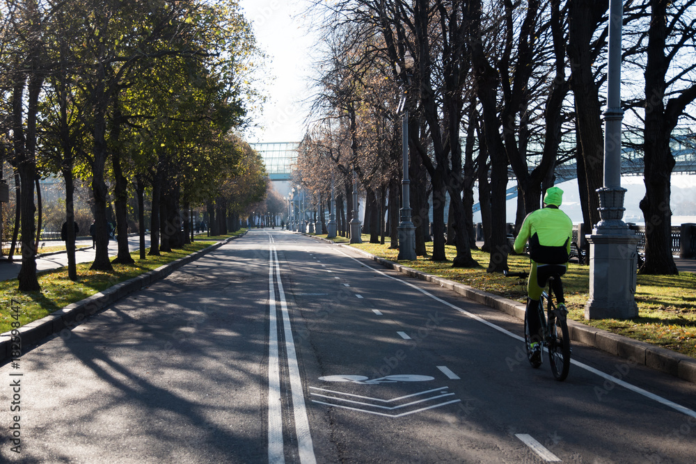 Bicycle lane road marks on asphalt road in the city park Bicycle lane road marks on asphalt road in the city park