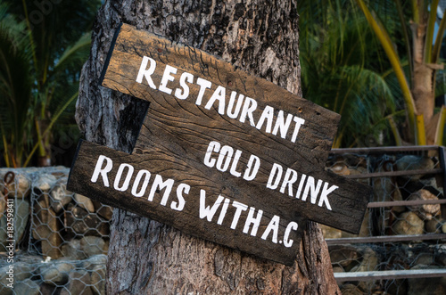 Sign RESTAURANT, COLD DRINK and ROOMS WITH AC.