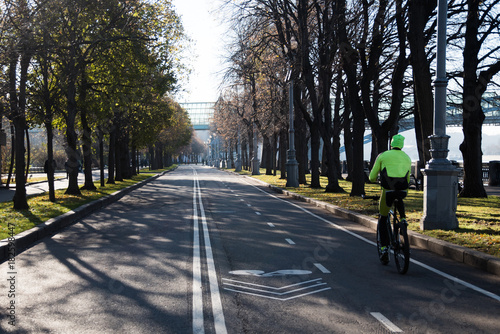 Bicycle lane road marks on asphalt road in the city park © VladFotoMag