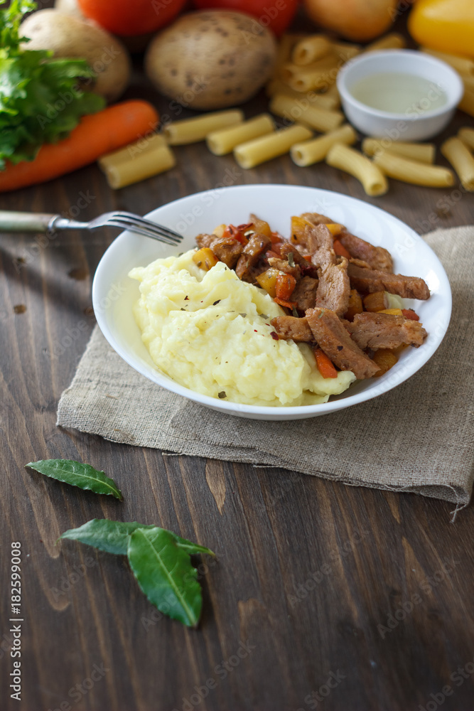Soy meat with potato puree over kitchen table. Soy meat with potato puree over kitchen table.