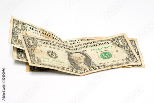 Stack of one dollar bills on white background.