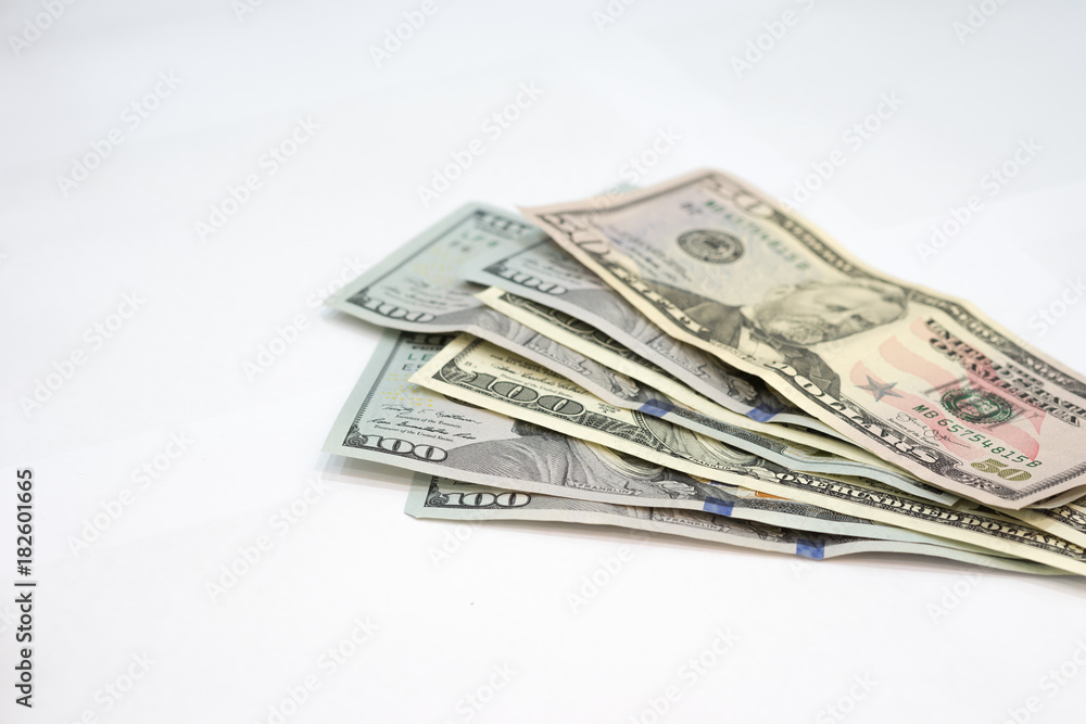 Pile of various US american dollar money bills spread on white background. Pile of various US american dollar money bills spread on white background.