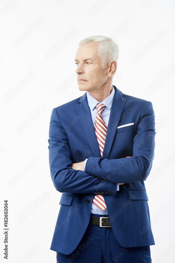 Elderly businessman satnding against white isolated background Elderly businessman satnding against white isolated background