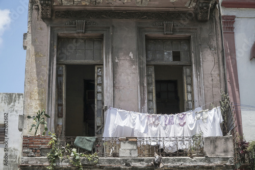 Photography hanged clothes at balcony of an apartment