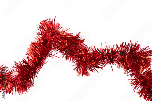 Red tinsel on white background. Line of bright glitter tinsel garland isolated on white background  horizontal image. New Year decorative element.