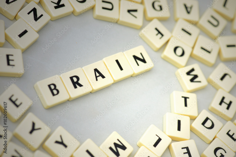 text brain on the gray background near the letters. text brain on the gray background near the letters.