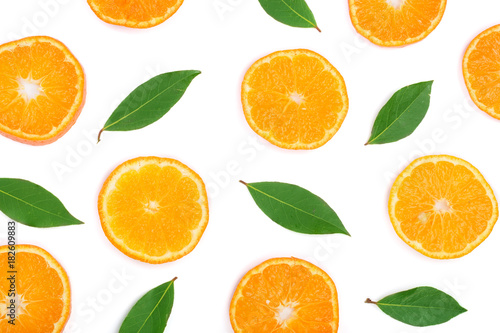 Slices of orange or tangerine with leaves isolated on white background. Flat lay, top view. Fruit composition