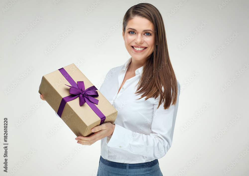 Smiling business woman holding paper gift box. Smiling business woman holding paper gift box.