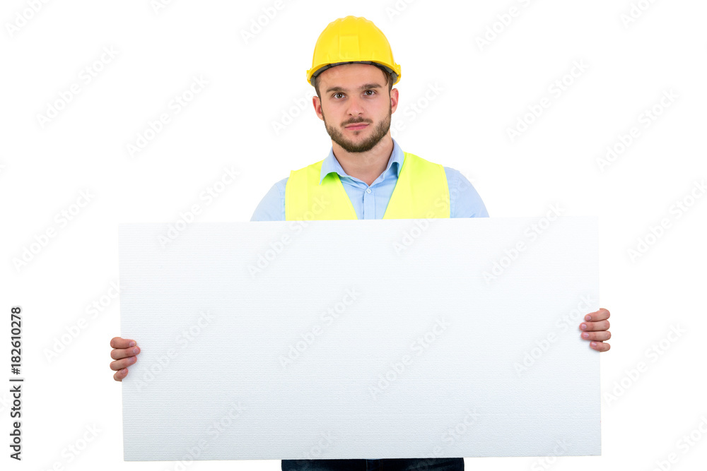 Happy male engineer holding an advertisement blank banner. Isolated on white background Happy male engineer holding an advertisement blank banner. Isolated on white background