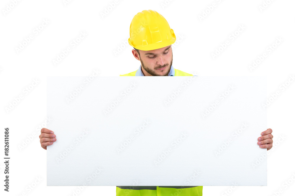 Happy male engineer holding an advertisement blank banner. Isolated on white background Happy male engineer holding an advertisement blank banner. Isolated on white background