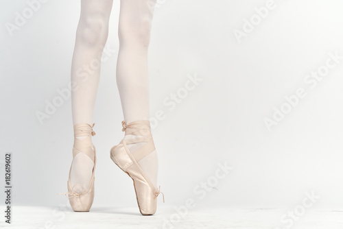 ballerina's legs in pointe shoes