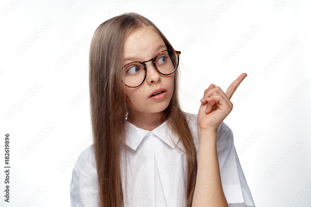girl in white shirt indicates direction and is bewildered girl in white shirt indicates direction and is bewildered