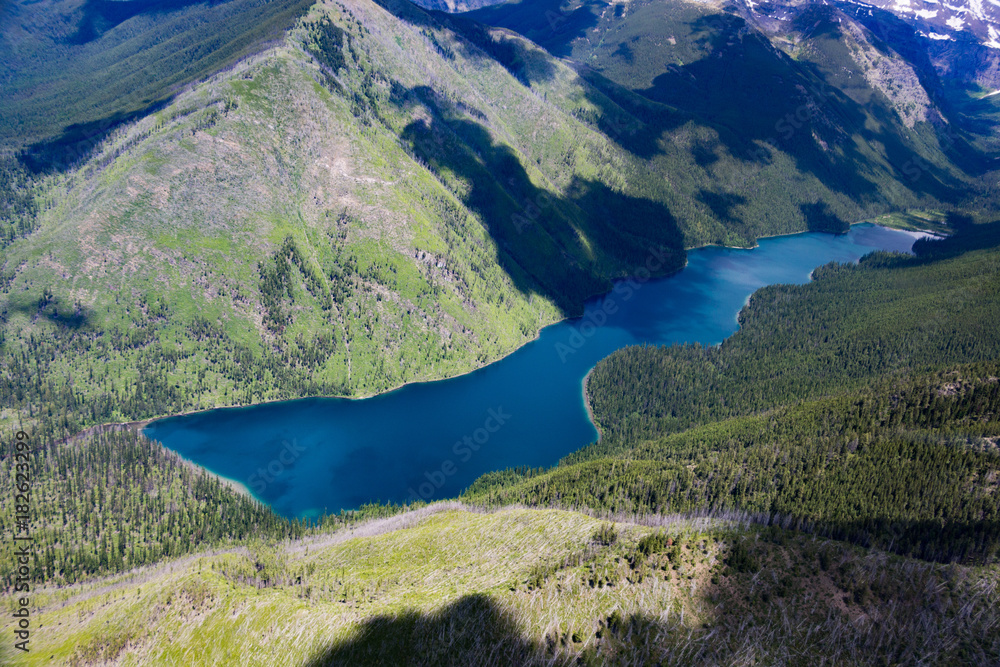 Fototapeta premium Aerial View of Glacier National Park mountains and lakes
