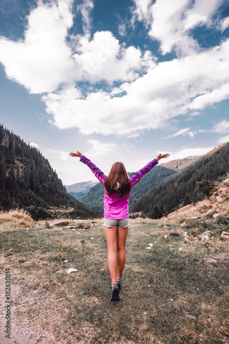 Outdoor close up portrait stylish hipster girl behind amazing mountains landscapes,girl in sportswear, sexy model, girl hiking