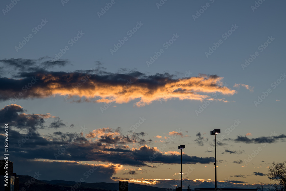 Cloudscape with stree light poles in the field of view Cloudscape with stree light poles in the field of view