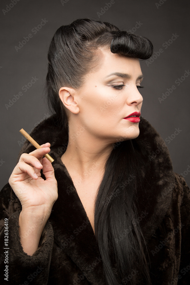 Obraz premium Beautiful lady with cigarette in fur coat. Cyberpunk theme. 