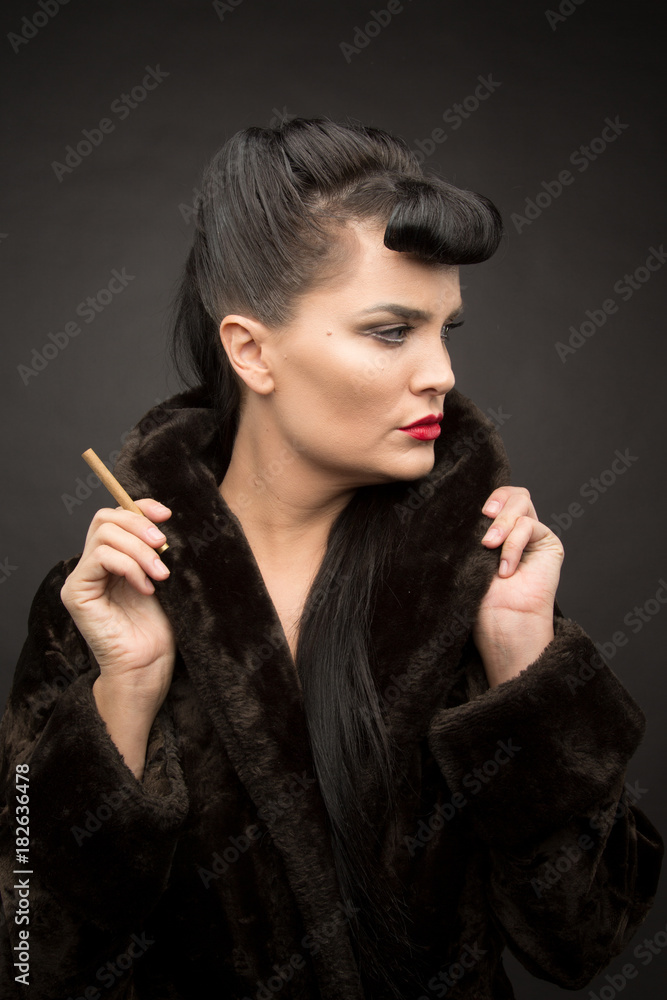 Obraz premium Beautiful lady with cigarette in fur coat. Cyberpunk theme. 