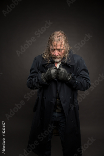 Older man in cold fog with long coat. Cyberpunk theme. © Vladimir Chopine