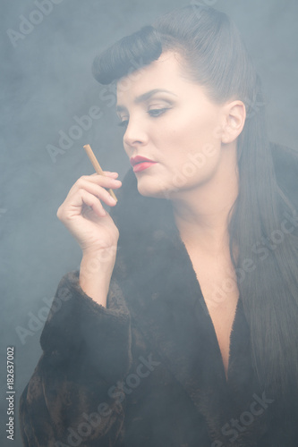 Cyberpunk themed beautiful girl with cigarette. Smoke environment.