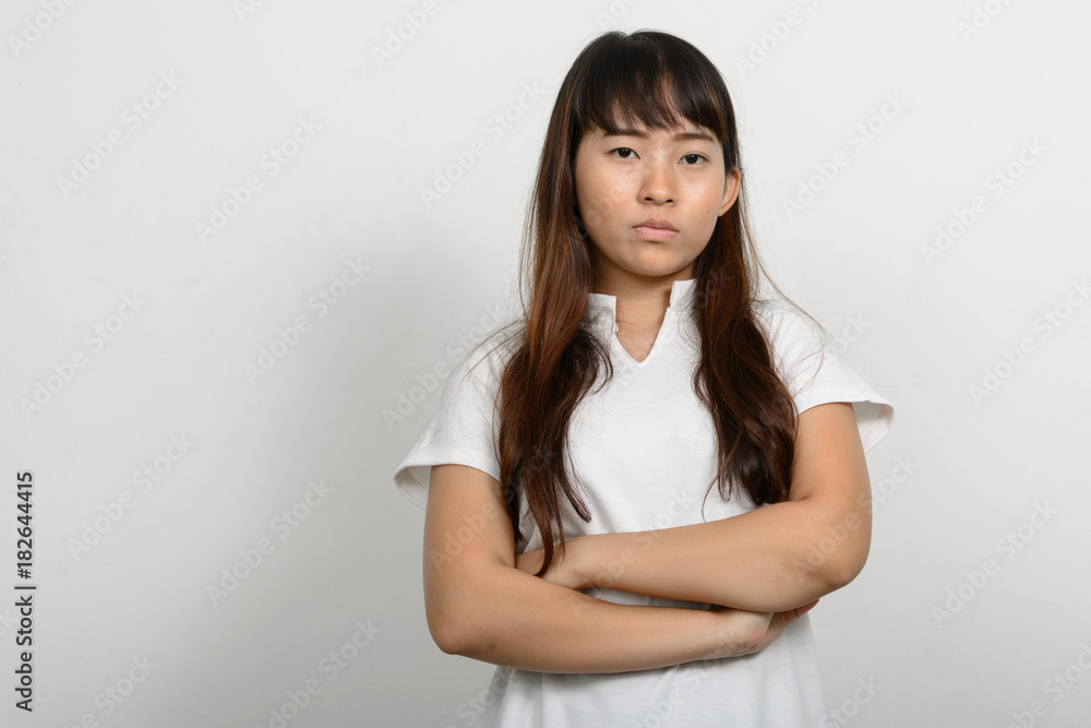 Portrait of beautiful Asian woman against white background Portrait of beautiful Asian woman against white background