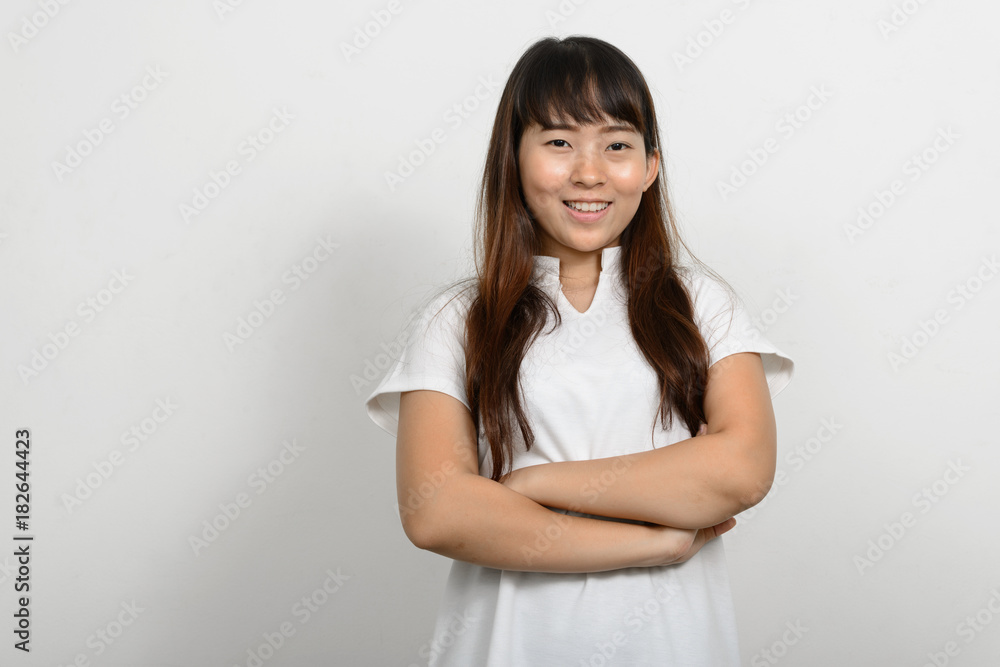 Portrait of beautiful Asian woman against white background Portrait of beautiful Asian woman against white background