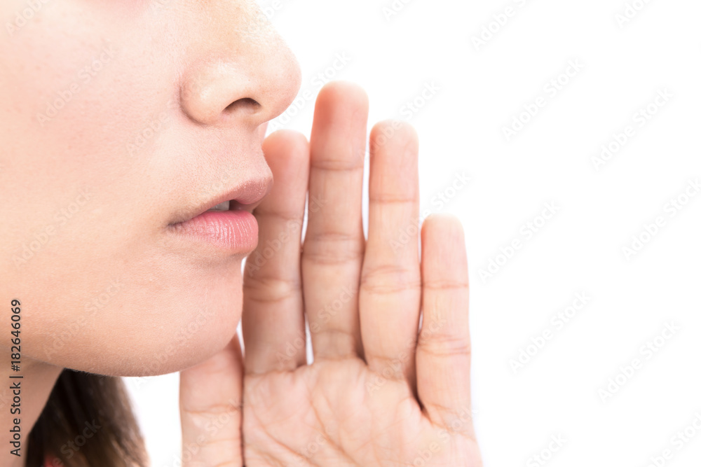 Woman whispering message isolated on white background Woman whispering message isolated on white background