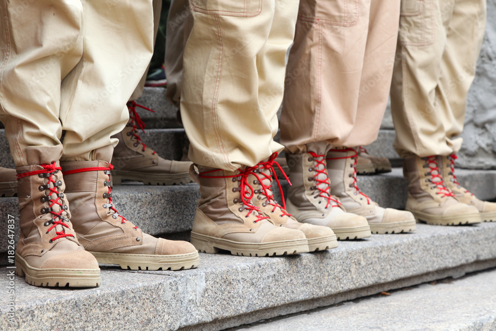 Legs in beige sand color footwear army boots Stock Photo | Adobe Stock