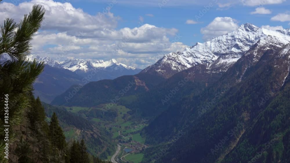 Beautiful top view of high snow-covered mountains and valley with road and village in Switzerland, 4k
Beautiful top view of high snow-covered mountains and valley with road and village in Switzerland, 4k