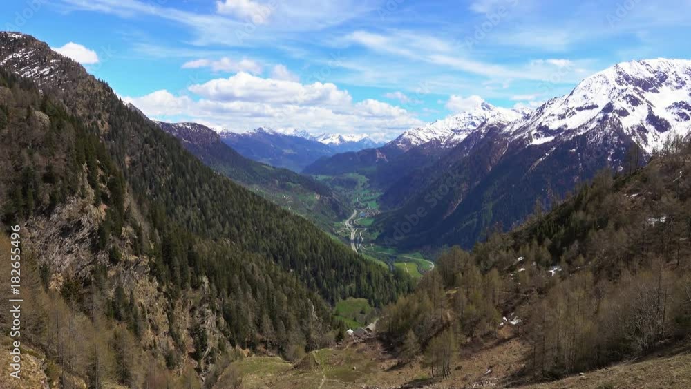 Beautiful top view of high snow-covered mountains and valley with road and village in Switzerland, tilt view 4k
Beautiful top view of high snow-covered mountains and valley with road and village in Switzerland, tilt view 4k