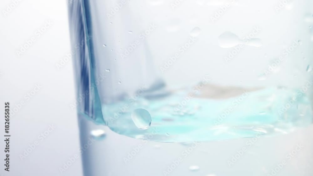 alcohol flowing into the glass, pour vodka alcohol flowing into the glass, pour vodka