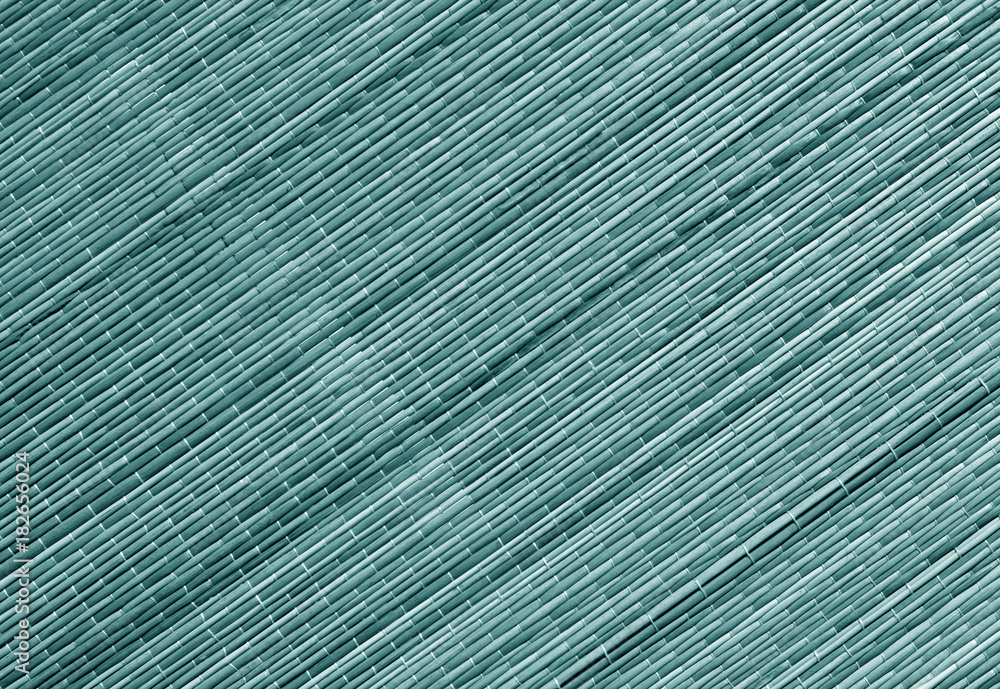Obraz premium Cyan toned straw mat surface.