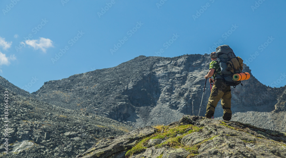 Man hiking in mountains. Landscape. Siberia.