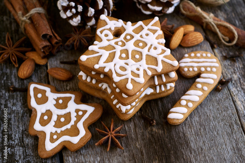 Homemade Christmas cookies on a wooden background with with star anise almond and cinnamon sticks