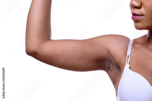 Bare shoulder and arm bent of a woman