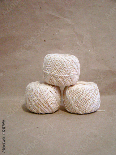 Wallpaper Mural Beads of beige yarn on gray paper close up Torontodigital.ca