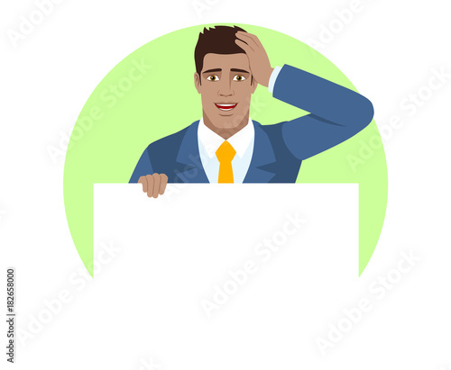 Businessman holding white blank poster and grabbed his head