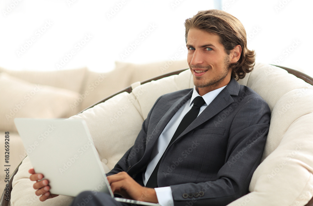 close-up of smiling businesswoman working with laptop in living room. close-up of smiling businesswoman working with laptop in living room.