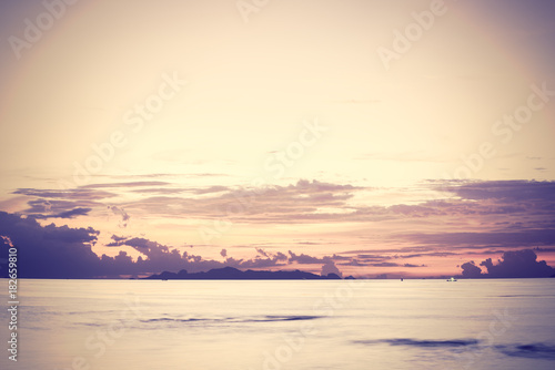 Sunset dramatic colorful tropical sea sky and cloud background,Long exposure image