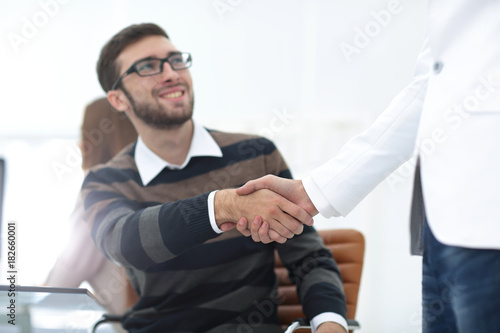 Fototapeta Naklejka Na Ścianę i Meble -  handshake between colleagues in the workplace
