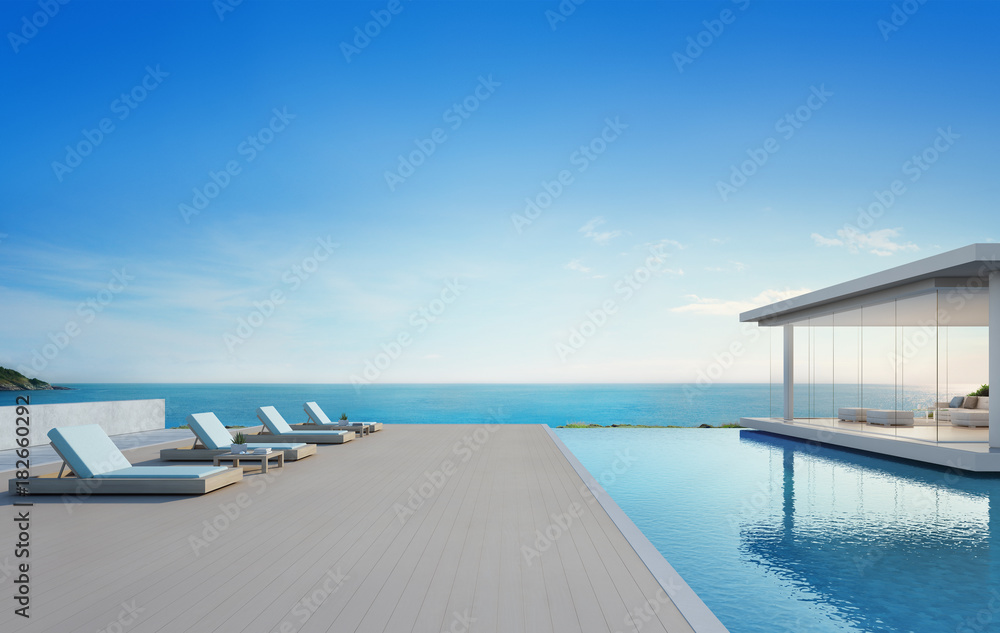 Fototapeta premium Luxury beach house with sea view swimming pool and terrace in modern design, Lounge chairs on wooden floor deck at vacation home or hotel - 3d illustration of contemporary holiday villa exterior