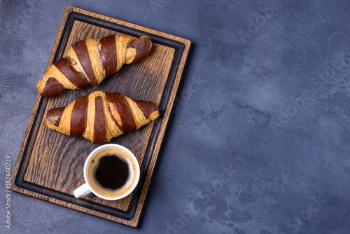 Two chocolate croissant and coffee on board