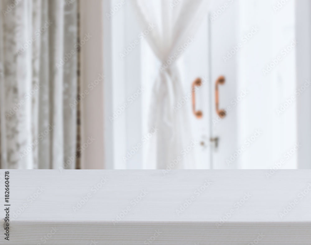 Wooden table top with white lace curtain and copper window handles in bathroom interior Wooden table top with white lace curtain and copper window handles in bathroom interior