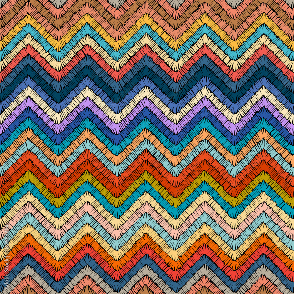 Embroidered seamless pattern. Colorful ornament. Striped background for textiles. Zigzags painted hands.