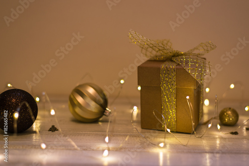 Christmas decoration with fir tree, gift box, garland lights, toys. Winter holidays, Merry Christmas, Happy New Year concept photo