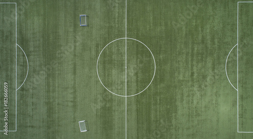 Classical empty old stadium from birds eye view. Drone view. Green Football soccer field. Aerial footage.