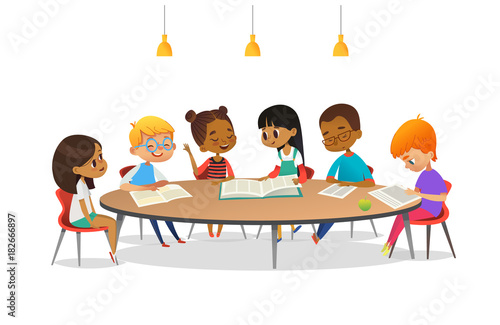 Boys and girls sitting around round table, studying, reading books and discuss them. Kids talking to each other at school library. Cartoon vector illustration for banner, poster, advertisement.